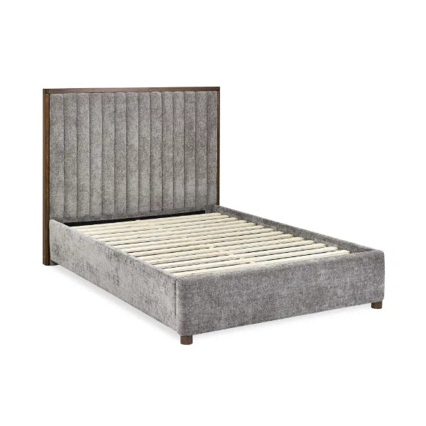 Whitmore upholstered double bed with vertical stitched headboard and walnut frame in a modern bedroom setting