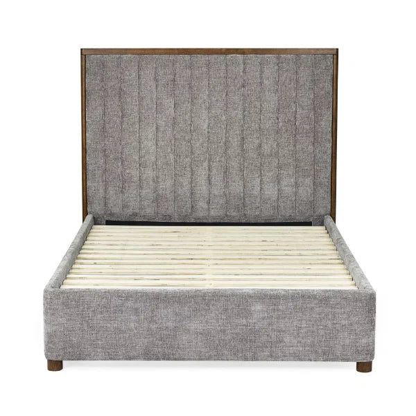 Whitmore upholstered double bed with vertical stitched headboard and walnut frame in a modern bedroom setting