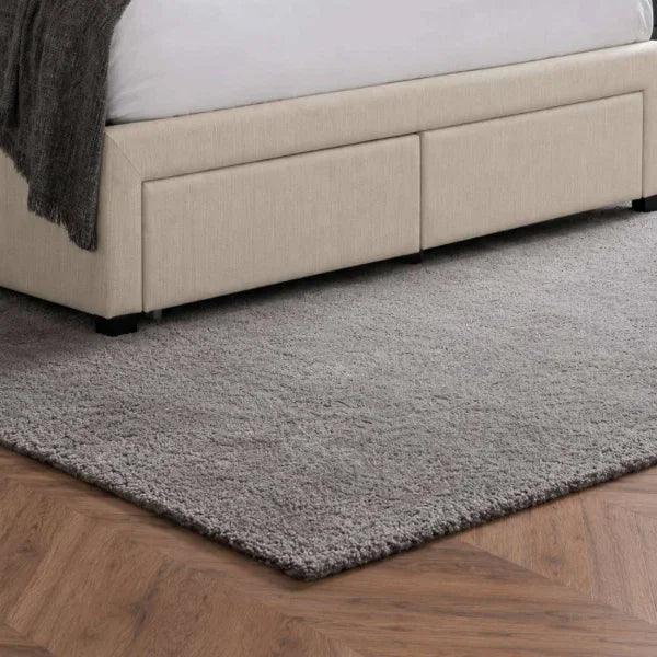 	Wilton oatmeal beige storage bed with deep buttoned headboard in a modern bedroom setting