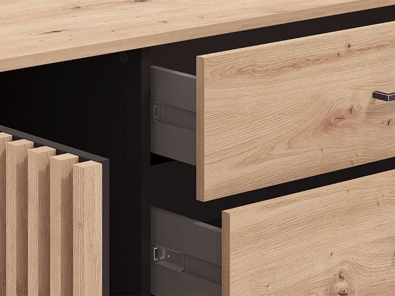 Amos Mann Furniture Asmara oak effect and black 4 drawer sideboard in a modern dining room setting