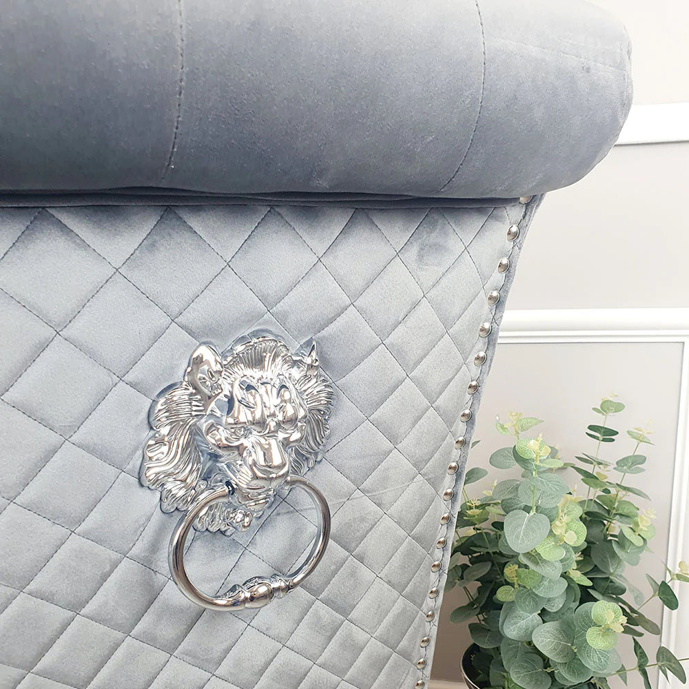Furnish365 Emma velvet dining chair with scroll top and chrome lion knocker in an elegant dining setting