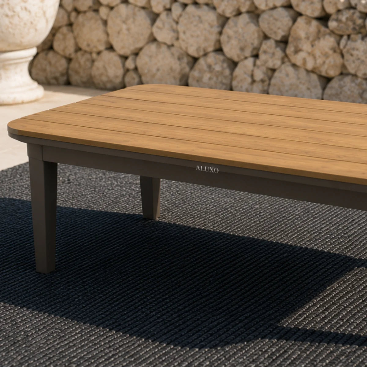 Furnish365 Hemera 5 seater outdoor lounge set with PS slatted wood table and aluminium frame in a modern garden setting
