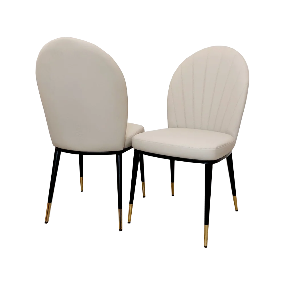 Furnish365 Etta dining chair in soft neutral fabric with curved backrest and gold-tipped legs in a contemporary dining setting