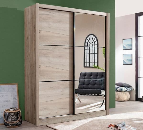 Amos Mann Furniture Navara oak effect sliding wardrobe with full-length mirror in a modern bedroom setting