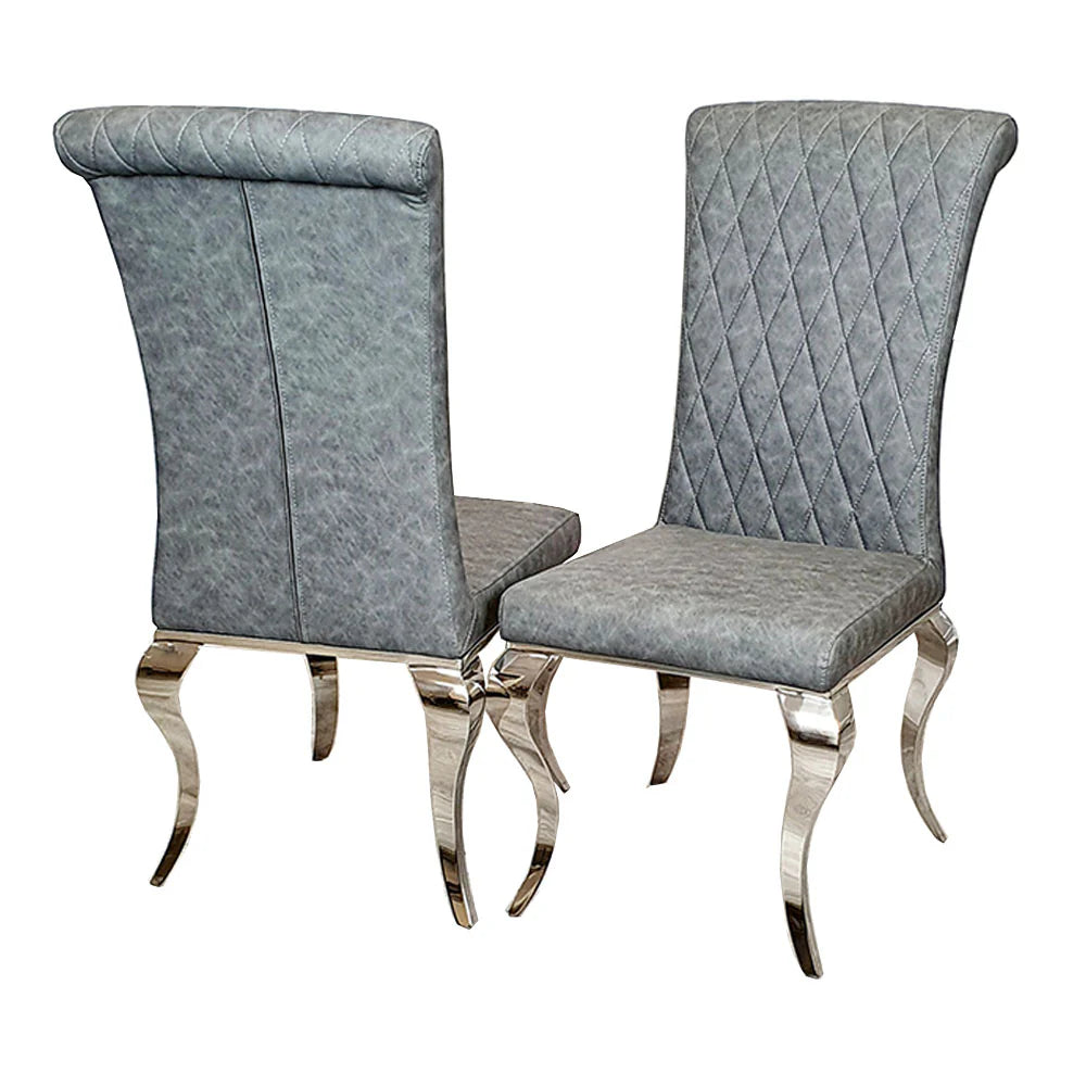 Furnish365 Nicole leather dining chair with high scroll top and chrome legs in an elegant dining setting